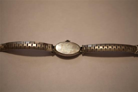 A ladys late 1920s 18ct white gold and diamond set cocktail watch,